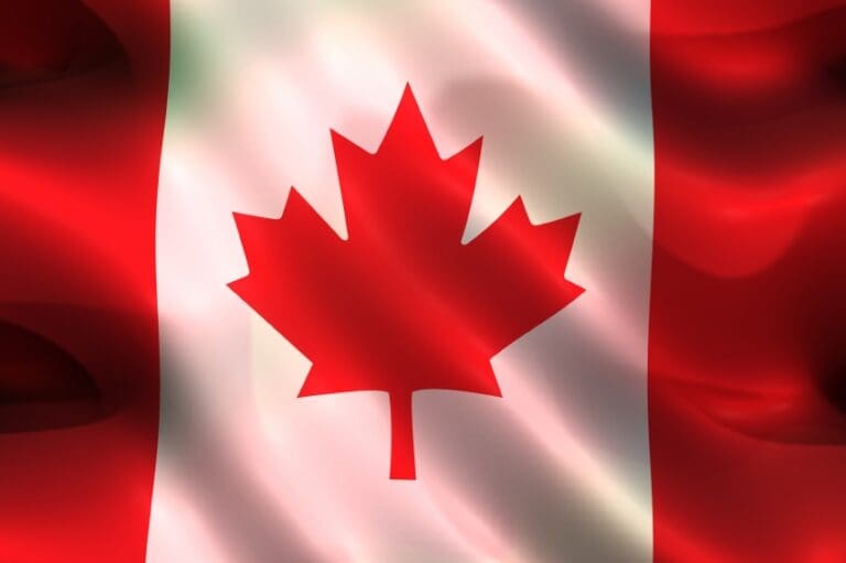 Waving Canadian flag with maple leaf.