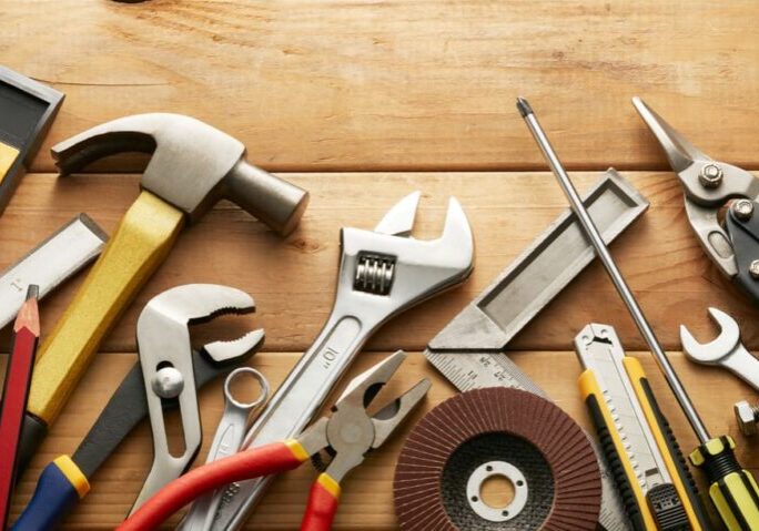 variety of tools on wood planks with copy space