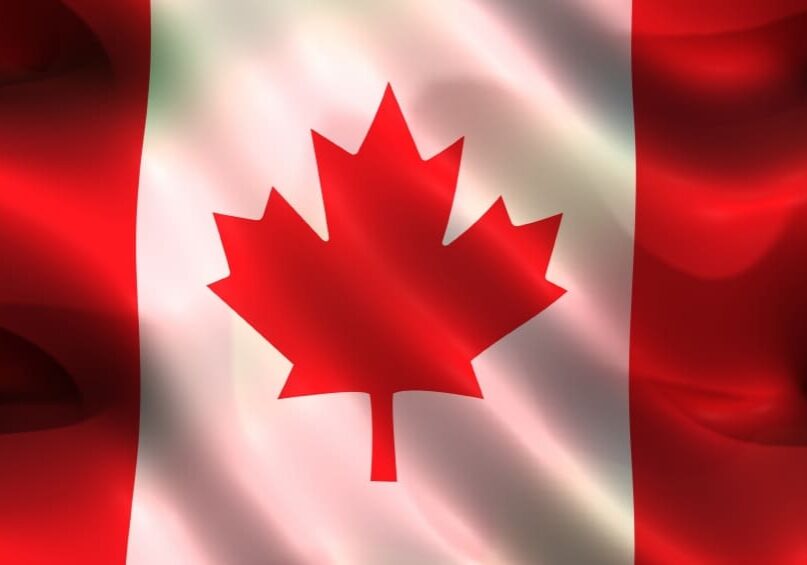 Waving Canadian flag with maple leaf.